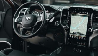 The inside of a RAM vehicle with a giant touch screen navigation instillation