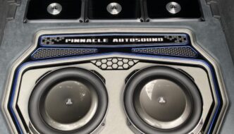 A pinnacle autosound speaker set installed in the trunk of a vehicle