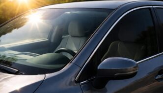 A car without window tint in the sun